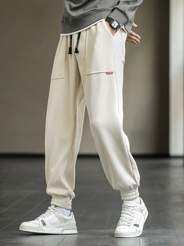 Stylish men's corduroy joggers with elastic hem, featuring drawstring closure and pockets, perfect for casual comfort - Model SF1410.